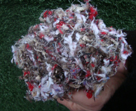 Image of hands holding a clump of our Equus Premier fiber